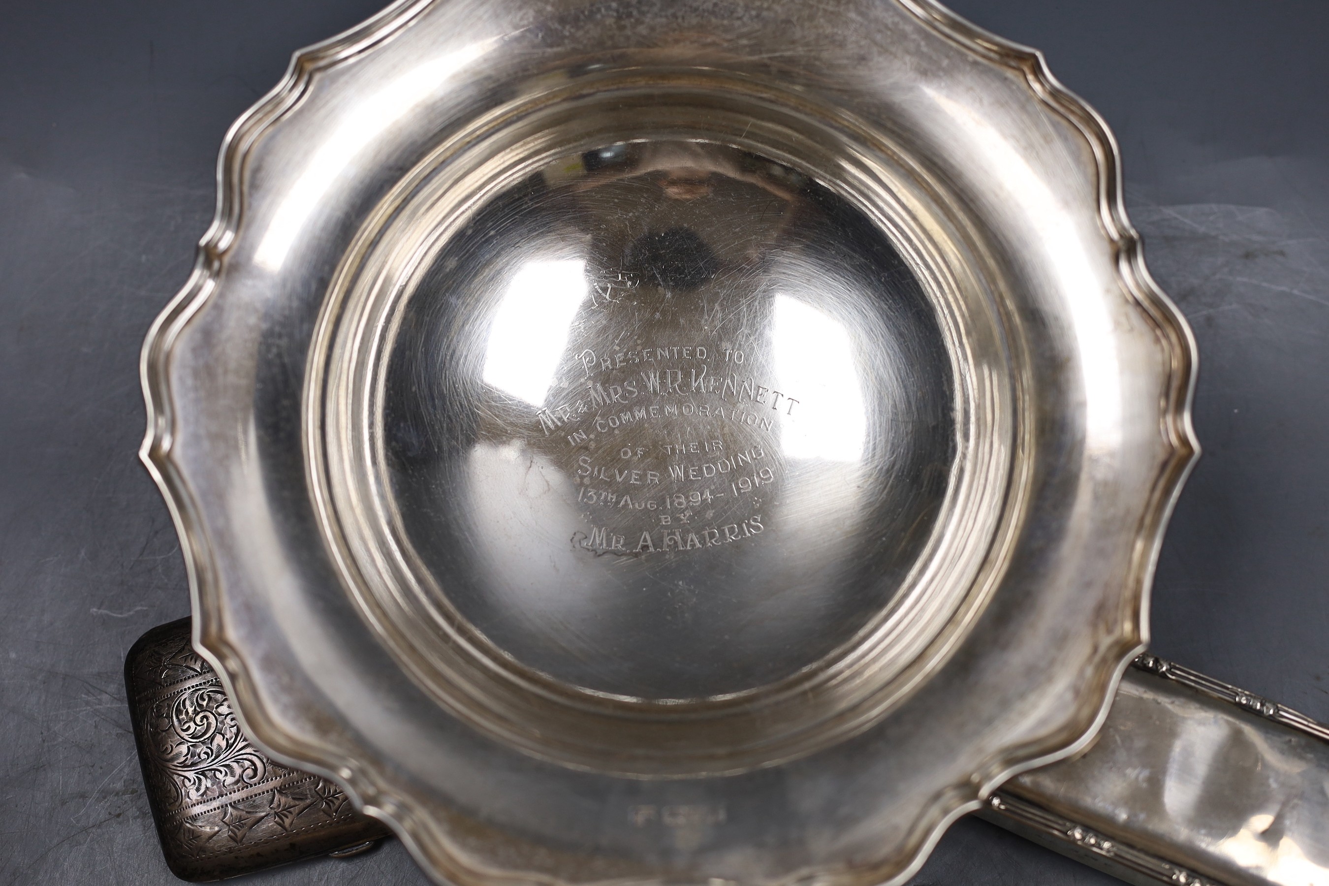 A George V silver pedestal dish, with presentation inscription, Barker Brothers , Chester, 1918, diameter 21.2cm, 9oz, a silver cigarette case and a silver mounted rectangular trinket box